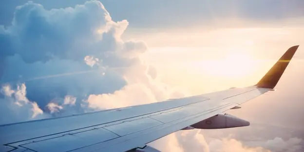 view looking out onto airplane wing in the sky