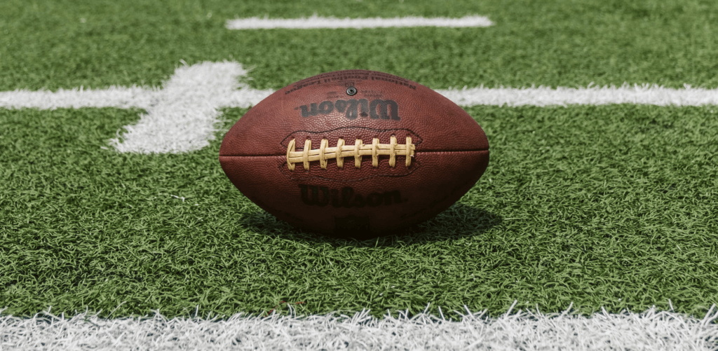 football laying on football field