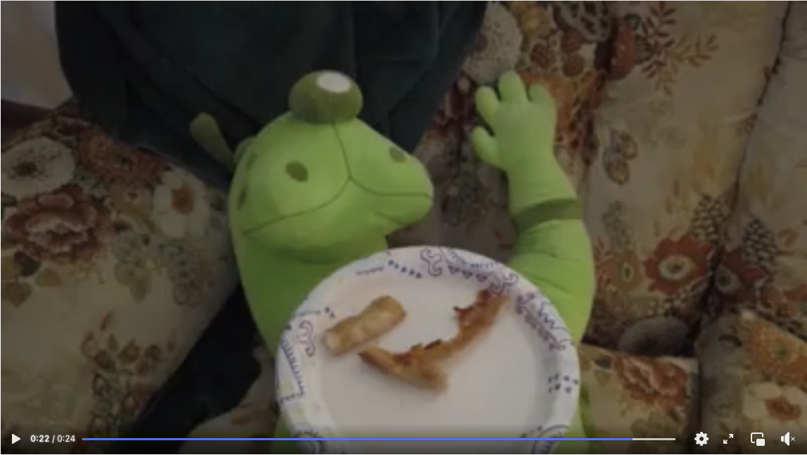 Facebook video thumbnail of Flex, NPA mascot, eating pizza