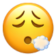 A exhaling emoji