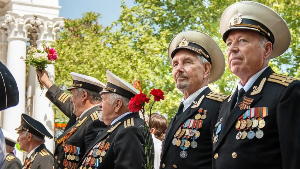 Group of men in decorated in military uniforms.