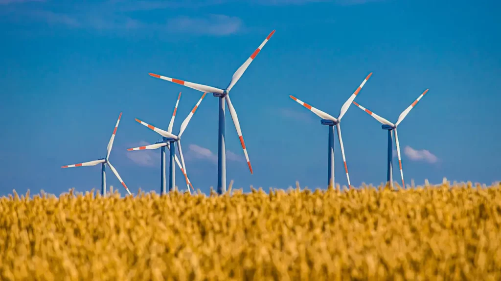 Image of six windmills captured against a blue sky