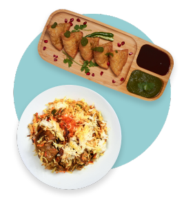 samosas and chicken biryani on plates