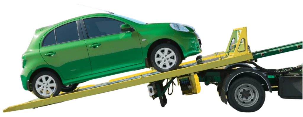green car on a flatbed truck